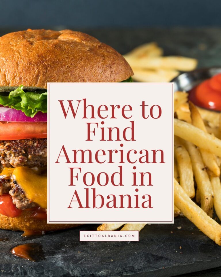 A gourmet cheeseburger and a side of french fries served on a dark slate plate, with a text overlay reading "Where to Find American Food in Albania" and the exittoalbania.com link.