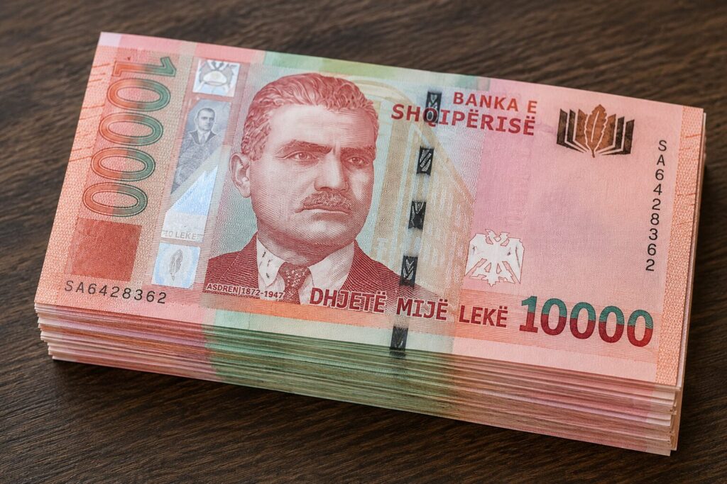 Stack of Albanian lek banknotes showing the 10,000 LEK denomination