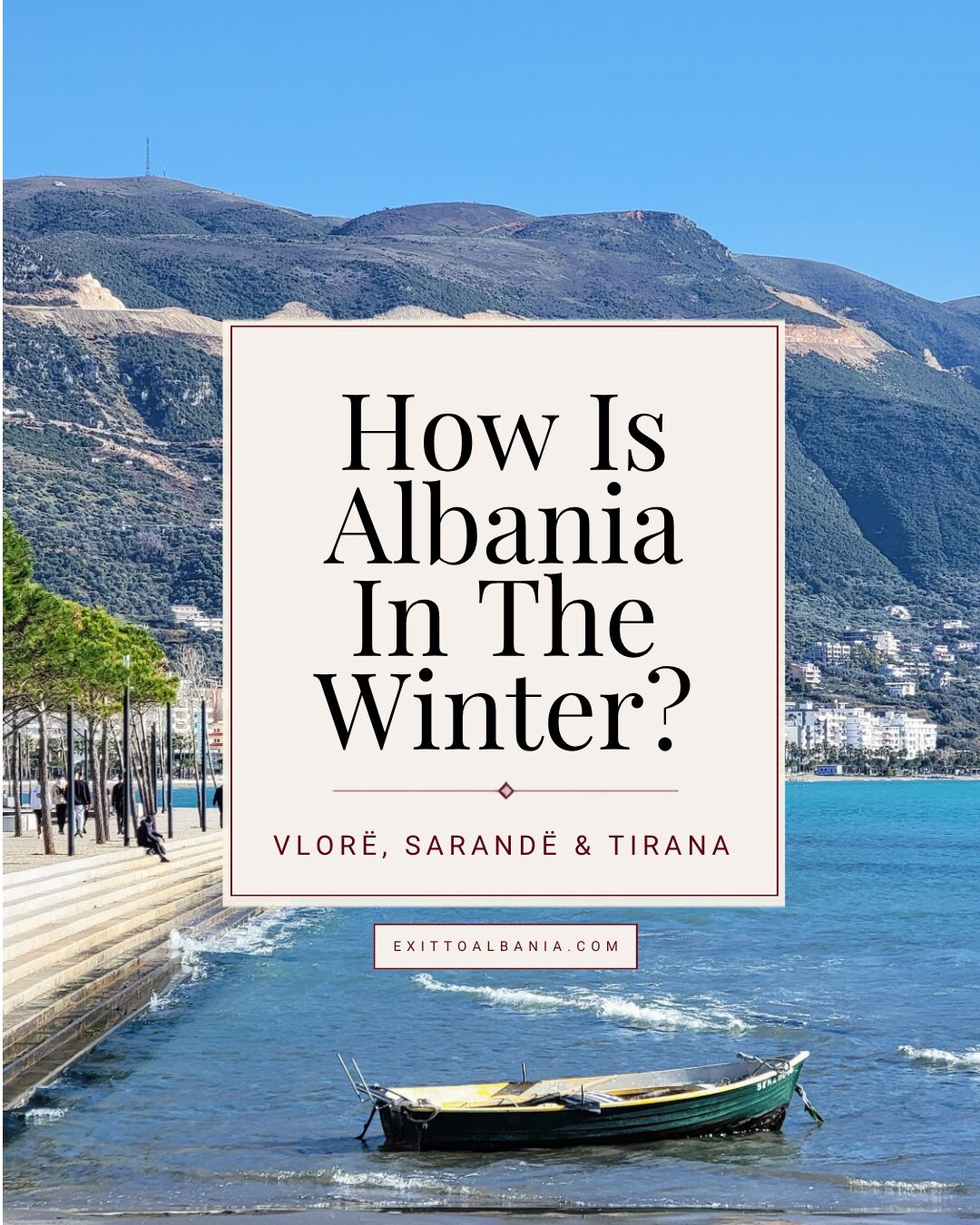 Winter waterfront in Vlorë, Albania, with mountains, blue sea and a small fishing boat